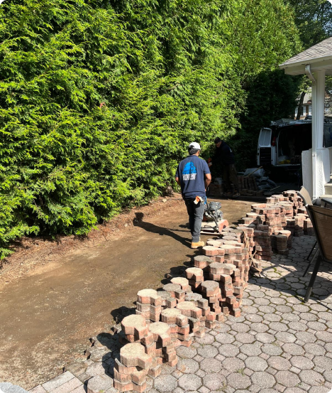 Skilled bricklayer at work in New Jersey, carefully placing bricks for a new wall construction.