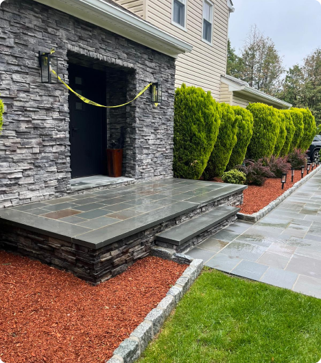Newly completed residential masonry project in New Jersey featuring elegant stonework.
